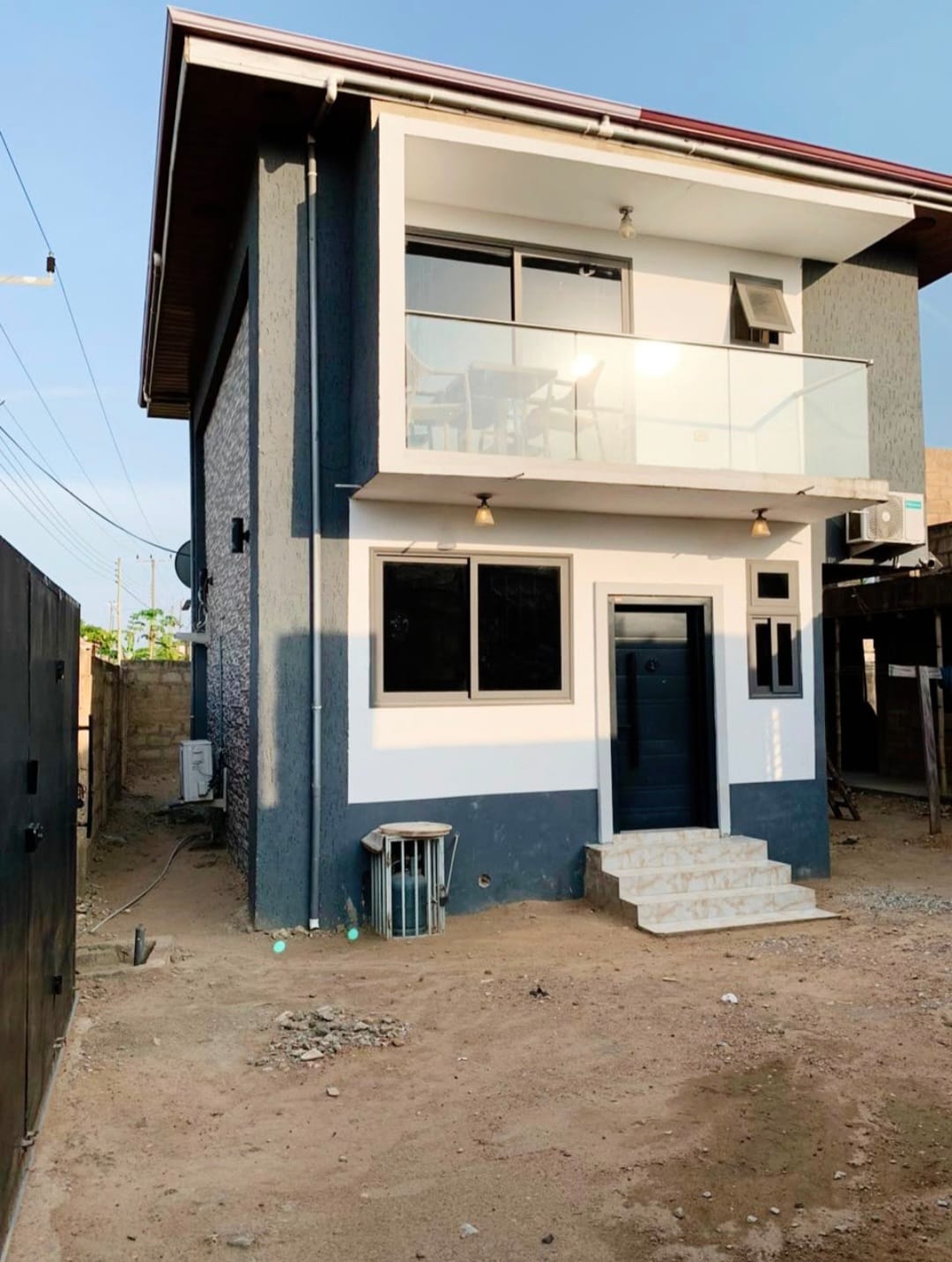 Completed home exterior with balcony